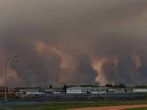 Wildfires burn from a controlled burn approximately three kilometres south of High Level on Wednesday, May 22, 2019.