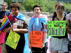 LGBTQ supporters attend a city hall protest of UCP's changes to GSA laws under Education Act reforms in Calgary on Sunday, June 9, 2019.