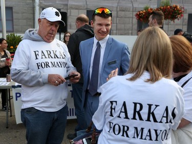 Calgary City Councillor Jeromy Farkas talks with supporters who were among hundreds of Calgary business owners who rallied outside City Hall to protest huge hikes in business taxes on Monday morning June 10, 2019. Gavin Young/Postmedia