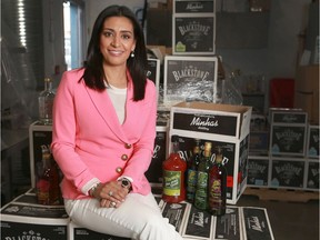 Manjit Minhas, president and CEO of Minhas Micro Brewery, poses in the company’s new winery and distillery facility.