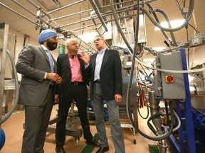 (L-R) Navdeep Bains, Minister of Innovation, Science and Economic Development, joins Bill Greuel, CEO Protein Industries Canada and James Szarko, CEO, Botaneco Inc. on a tour of at the Botaneco facility in northeast Calgary on Wednesday, June 26, 2019.