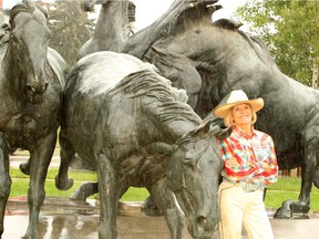 Georgia Desmarais poses in front of the massive "By the Banks of the Bow" horse sculpture located in front of the Agriculture Building at Stampede Park. Thursday, June 27, 2019. Brendan Miller/Postmedia