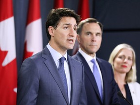Prime Minister Justin Trudeau speaks during a news conference about the government's decision on the Trans Mountain Expansion Project with Finance Minister Bill Morneau and Environment Minister Catherine McKenna in Ottawa.