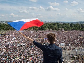 A man holds a Czech National flag during a rally demanding the resignation of Czech Prime Minister Andrej Babis on June 23, 2019 in Prague. - Huge crowds flooded central Prague demanding Prime Minister Andrej Babis to step down over allegations of graft in a protest that organisers and local media claim drew around 250,000 people, which would make it the largest since the fall of communism in 1989. (Photo by Michal Cizek / AFP)MICHAL CIZEK/AFP/Getty Images