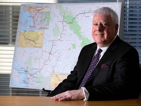 Ian Anderson, President of Kinder Morgan Canada, was photographed in the company's Calgary office in front of a map of the Trans Mountain pipeline route on Tuesday December 20, 2016.