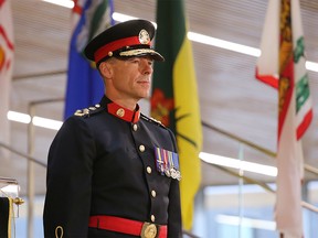 Mark Neufeld is sworn in as Calgary's new police chief at the Central Library on Monday.