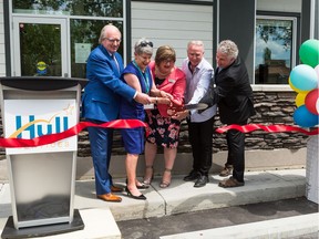 Pictured, from left, at the official opening of Hull Services Mike's House are, Bob Harris, CEO of Centron; Leslie Bissett; Julie Kerr, executive director at Hull Services; Pat Foran, assistant program director for the Preadolescent Treatment Program at Hull Services; and Dr. Bruce D. Perry, senior fellow of The ChildTrauma  Academy. Courtesy, Suzan McEvoy