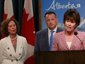 Alberta Energy Minister Sonya Savage speaks to media regarding the federal decision on Bill C-69 while Bronwyn Eyre, Saskatchewan Minister of Energy and Resources and  Greg Rickford, Ontario Minister of Energy, Mines and Northern Development listen on Wednesday.