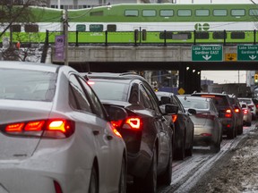 A GO train above vehicles lining up on Jarvis St. to exit onto the Gardinder Expressway ramp during the evening rush hour in Toronto, Ont. on Tuesday January 22, 2019.