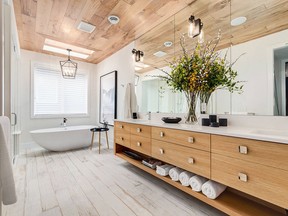 The ceiling is a great place for flooring. Trickle Creek Custom Homes used plank flooring to give the ceiling a warm tone.