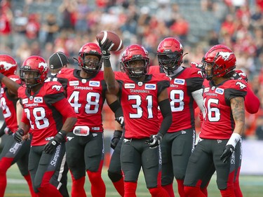 Stamps Tre Roberson (C) holds the ball high after a recovery during CFL action between the Ottawa Redblacks and the Calgary Stampeders in Calgary on Saturday, June 15, 2019. Jim Wells/Postmedia