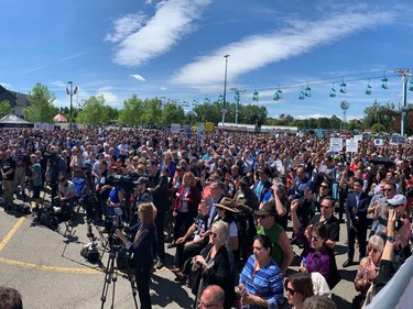Thousands of people attend a pro-oil and gas rally outside of the Global Petroleum Show in Calgary.