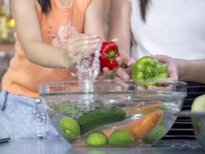 The Food and Drug Administration recommends washing produce under cold running water - go ahead and wash your hands before and after you do the food, too.