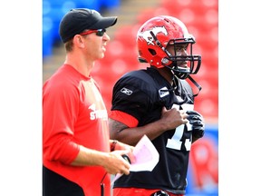 Stamps coach Dave Dickenson is pictured with quarterback Kevin Glenn during Calgary Stampeders pre-season practice at McMahon Stadium in this photo from June 12, 2012. Postmedia file photo