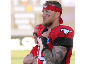 Stamps quarterback Bo Levi Mitchell spent the last few plays of Saturday night's game on the sidelines with an apparent shoulder injury. Photo by Brendan Miller/Postmedia.