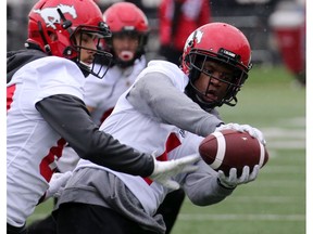 Calgary Stampeders wide receiver Hergy Mayala catches a pass while being covered by Colton Hunchuk during training camp at McMahon Stadium on Tuesday, May 21, 2019. Gavin Young/Postmedia