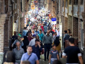 People shop in a shopping street called Grand Bazaar in downtown Tehran, Iran June 23, 2019.