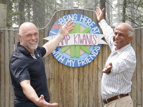 Grant Kelba, President of the Calgary Downtown Kiwanis Club, joins Mike Shaikh, the former president of the Calgary Kiwanis Club, to pose for a photo at Kamp Kiwanis. This month the Calgary Kiwanis Club is celebrating 100 years of service in Calgary and it's surrounding communities. Friday, May 31, 2019. Brendan Miller/Postmedia