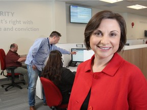 Enmax CEO Gianna Manes, seen here in the customer care centre, announced she will retire from the job in May 2020.