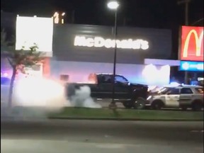 Two people are in police custody after the driver of a truck rammed two RCMP vehicles at a McDonald's drive-thru in Westlock, Alta, on Friday, June 14, 2019.