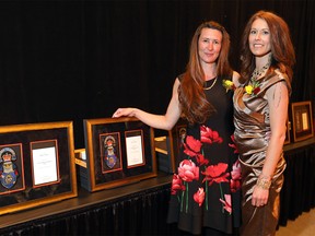 L-R, Kim Cossette – Award of Exceptional Recognition for Valour and Chevy Wilson – Award of Exceptional Recognition were honoured for their actions on Sept. 26, 2018, when a woman was carrying her three-year-old daughter while walking home from the Franklin LRT station as a random woman approached the mother and child and began trying to rip the child from her mother’s arms during the Calgary Police Service 2019 Chief’s Awards Gala at the BMO Centre in Calgary on Thursday, June 6, 2019. Darren Makowichuk/Postmedia