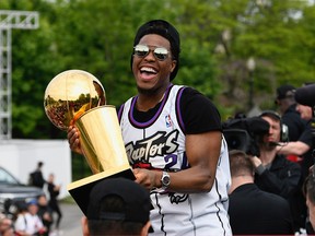 Toronto Raptors guard Kyle Lowry holds the NBA Championship Trophy during the Raptors parade celebration in Toronto on June 17, 2019.