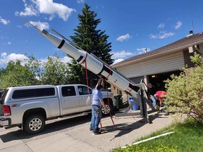 A scale model of a Saturn V rocket sits on a Beddington driveway in northwest Calgary. A group of rocket enthusiasts is preparing for a June 29 launch near Lethbridge.