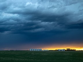 A storm rolls in at sunset east of Crossfield last year. The area is in for more turbulent weather today, with a funnel cloud spotted near Olds.
