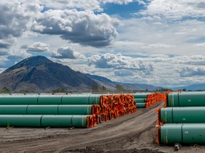 Steel pipe to be used in the oil pipeline construction of the Canadian government’s Trans Mountain expansion project lies at a stockpile site in Kamloops, British Columbia, on June 18, 2019.