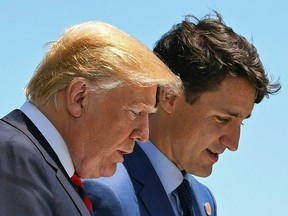 U.S. President Donald Trump, left, speaks with Canadian Prime Minister Justin Trudeau during the G7 Summit in La Malbaie, Quebec, Canada last year. Trudeau will meet with Trump Thursday in Washington.