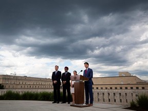 Canada's Prime Minister Justin Trudeau speaks as Canada's Finance Minister Bill Morneau, Canada's Defense Minister Harjit Sajjan, and Canada's Foreign Minister Chrystia Freeland listen during a news conference at the Canadian Embassy, in Washington, U.S. June 20, 2019.