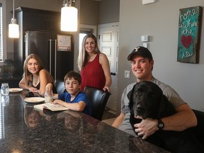 Mandy Merrill and her husband Bryan Wyllie with their children Justice Heather, 15, and Brodyn Merrill, 9, enjoy their new home in Cochrane.