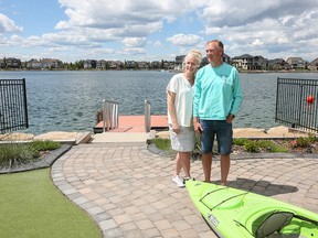 Debbie and Greg Peterson love all the amenities of living in a lake community. Here they are in their backyard in Auburn Bay.