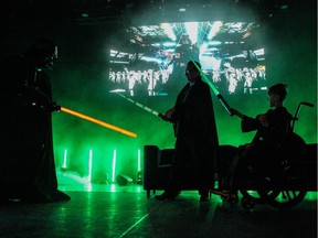 Children's Wish Kid Jaxon and ATB executive vice-president Tim Gillespie battle Darth Vader at the Night of Wonders Gala on May 23. Photo courtesy Evan Machacek