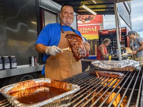 Rob Reinhardt, owner and pit master at Prairie Smoke & Spice BBQ, displays his products at the Calgary Stampede on Wednesday, July 10, 2019.