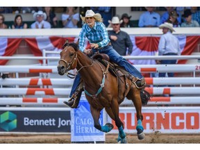 Callahan Crossley from Hermington, Ore., competes in Barrel Racing during Wild Card Saturday at the Calgary Stampede Rodeo. Photo by Azin Ghaffari/Postmedia.