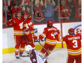 Calgary Flames, Andrew Mangiapane scores on Colorado Avalanche goalie, Philipp Grubauer in second period action of game 1 of the NHL Play-Offs at the Scotiabank Saddledome in Calgary on Thursday, April 11, 2019. Darren Makowichuk/Postmedia