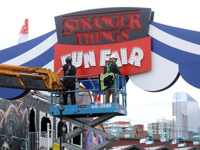 Crews set up the midway which will be featuring the hit show Stranger Things theme for Stampede at Stampede Park in Calgary on Wednesday, July 3, 2019.