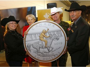 L-R, Ms. Michelle Grant, Victory Stampede Coin Designer, Ms. Phyllis Clark, Chair, Royal Canadian Mint Board of Directors, Brigadier General Stephen Lacroix, Commander, 3rd Canadian Division/ Joint Task Force West and Honorary Stampede Parade Marshal and Mr. Warren Connell, CEO, Calgary Stampede as The Royal Canadian Mint joins Calgarians in celebrating the 100th anniversary of the 1919 Victory Stampede with the unveiling of a silver collector coin commemorating the historic rodeo honouring Canada's First World War soldiers at Stampede Park in Calgary.