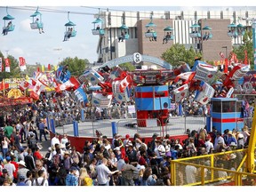 The packed Midway during the Calgary Stampede in Calgary on Tuesday, July 9, 2019. Darren Makowichuk/Postmedia