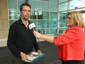 Calgary Radio host Kumar Sharma speaks to reporters in the courthouse on Friday, July 19, 2019.