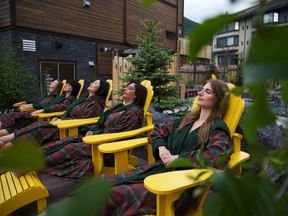 Guests relax in Adirondack chairs on at Kananaskis Nordic Spa. Courtesy, Whitney Arnott