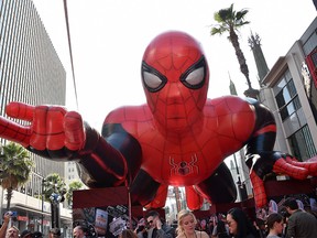 (FILES) In this file photo taken on June 26, 2019 a giant inflatable Spider-Man is displayed on the red carpet for the Spider-Man: Far From Home World premiere at the TCL Chinese theatre in Hollywood. - Once again Spider-Man seems to be trapping everything that flies by: "Spider-Man: Far From Home" took in an impressive $93.6 million in North America over the US holiday weekend and has passed the half-billion-dollar mark worldwide, industry watcher Exhibitor Relations estimated on July 7, 2019. This latest in the Spider-Man franchise, made by Sony and Disney-owned Marvel, set a record six-day total for a Tuesday release of $185.1 million, according to the Hollywood Reporter. (Photo by Chris Delmas / AFP)CHRIS DELMAS/AFP/Getty Images