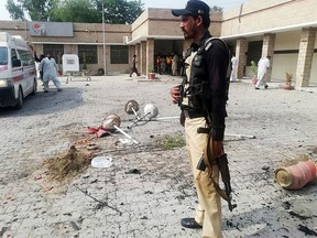 A Pakistani policeman stands guard at site of a suicide bomb attack a hospital entrance in Kotlan Saidan village on the outskirts of the northwestern city of Dera Ismail Khan on July 21, 2019. - A female suicide bomber killed six people -- including two policemen -- in Pakistan's restive northwest Sunday in an attack claimed by the Taliban, officials said. The attack happened at the entrance of a hospital in Kotlan Saidan village on the outskirts of the northwestern city of Dera Ismail Khan. (Photo by Adil Mughal / AFP)ADIL MUGHAL/AFP/Getty Images