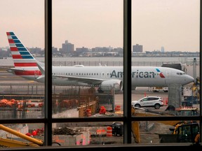An American Airlines 737 Max sits at the gate at LaGuardia airport in New York on March 13, 2019