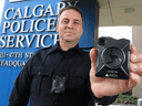 Calgary Police Service Staff Sgt. Travis Baker shows the service's new Axon body camera on July 3, 2018.