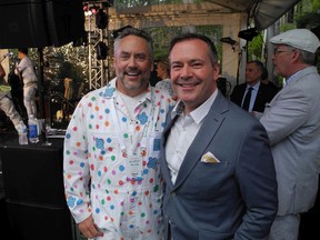 W. Brett Wilson's annual garden party is the stuff of legend and this year's, held June 24, continued its winning ways by raising more than $503,000 for 11 charities that support adolescent mental health. Pictured with the philanthropist is Premier Jason Kenney.