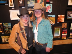 Pictured at the 2019 Calgary Stampede Art Show Stir' Up launch July 3 in the BMO Centre are Stampede director Kate Thrasher, left, and Western Showcase committee chair Shauna DeMaere.