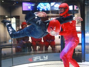 Postmedia reporter Sammy Hudes gets a flying lesson from instructor Ryan Nichols at the iFly Indoor Skydiving Centre located at Deerfoot City.  Wednesday, July 24, 2019. Dean Pilling/Postmedia