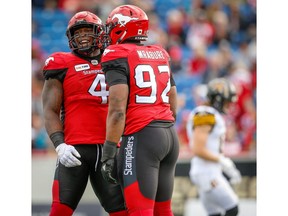 Calgary Stampeders Micah Johnson and Ese Mrabure against the Hamilton Tiger-Cats during CFL football in Calgary on Saturday, June 16, 2018. Al Charest/Postmedia